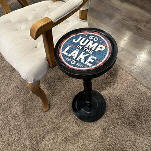 Rustic Black Accent Stool with 'Go Jump in the Lake' Top